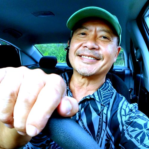 Krisada Eaton at 57, Work-Anywhere-Life has been great. In 2017 I started living part time in Hawaii. This was 2023, driving to Volcano House at Kilauea Volcano, Big Island HI. Krisada Eaton driving to Volcano House, Kilauea Volcano Big Island Hawaii